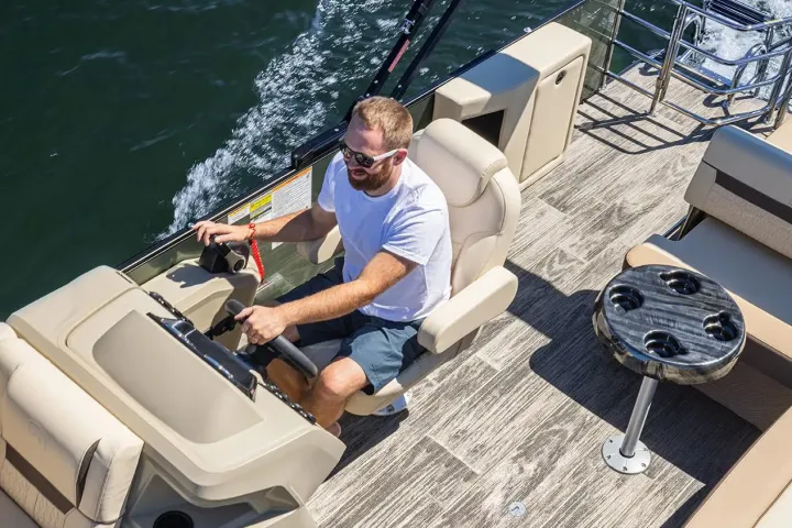 a man sitting on a boat in the water