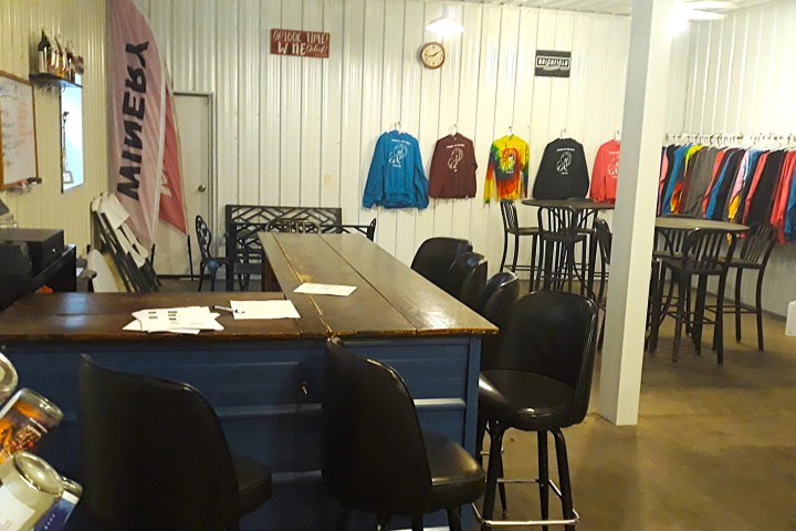 an office with a desk and chair in a room